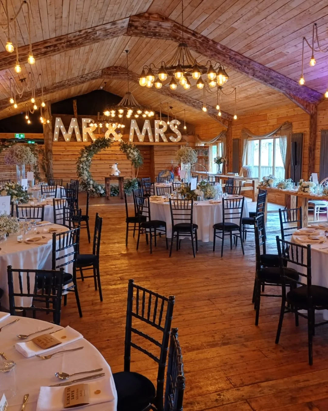 Silverwood’s timber wedding barn with tables dressed for a reception